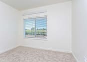 Thumbnail 11 of 25 - A room with a window covered by blinds. at Plisko Place, Port Orchard, WA, 98366
