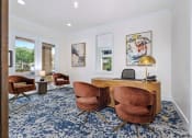 Thumbnail 9 of 30 - a home office with a desk and chairs
