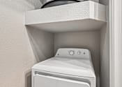 Thumbnail 60 of 64 - A white washing machine is installed in a wall.