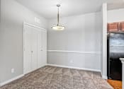 Thumbnail 54 of 64 - A room with a carpeted floor and a ceiling light.