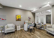 Thumbnail 15 of 45 - A waiting room with a clock on the wall.
