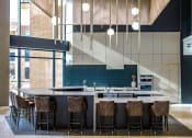 Thumbnail 9 of 75 - barstools around a counter in an indoor kitchen at The Apex at CityPlace, Overland Park, KS, 66210