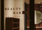 Thumbnail 25 of 75 - glass door with decal reading Beauty bar at apex looking into a conference room at The Apex at CityPlace, Overland Park, Kansas