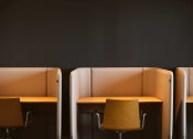 Thumbnail 47 of 75 - yellow chairs at desks with small privacy walls around them at The Apex at CityPlace, Overland Park, 66210