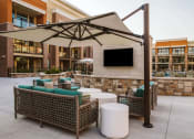 Thumbnail 3 of 75 - couches under a canapoy at an apartment complex outdoor pool at The Apex at CityPlace, Overland Park, KS, 66210