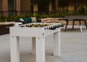 Thumbnail 4 of 75 - a foosball table on an outdoor patio at The Apex at CityPlace, Kansas