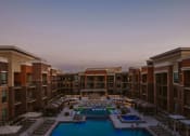 Thumbnail 60 of 75 - birds eye view of a large apartment complex and outdoor pool with seating at The Apex at CityPlace, Overland Park, 66210