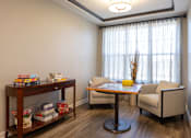 Thumbnail 19 of 34 - A puzzle activity seating area at Aspen Ridge 55+ Active Adult Community