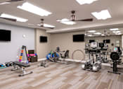 Thumbnail 20 of 34 - A gym with weights and cardio equipment at Aspen Ridge 55+ Active Adult Community