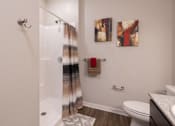 Thumbnail 8 of 34 - A full bathroom with a walk-in shower at Aspen Ridge 55+ Apartment Community in Olathe, KS