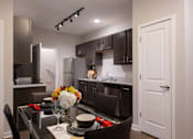 Thumbnail 11 of 34 - A fully-equipped kitchen at Aspen Ridge 55+ Apartment Community in Olathe, KS.