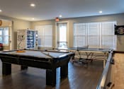 Thumbnail 23 of 34 - A clubhouse with a pool table and ping pong at Aspen Ridge 55+ Active Adult Community