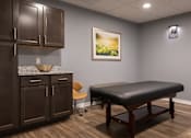 Thumbnail 29 of 34 - A massage table and a chair at Aspen Ridge 55+ Active Adult Community