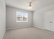 Thumbnail 1 of 36 - an empty room with a ceiling fan and a window at Hillcrest Village, Springdale, AR 72762