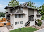 Thumbnail 1 of 19 - A modern two-story house with a balcony on the second floor.