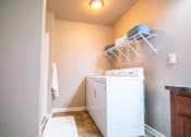 Thumbnail 20 of 42 - A White Washing Machine at Capitol Grove Apartments, Iowa, 50317