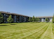 Thumbnail 42 of 42 - A Large Grassy Field at Capitol Grove Apartments, Iowa
