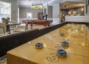 Thumbnail 19 of 50 - A pool table in a room with a billiard ball on it.