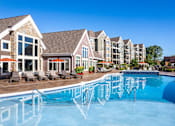 Thumbnail 12 of 53 - a large swimming pool with apartments in the background  at Waterside Residences on Quivira, Lenexa, 66215