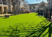 Thumbnail 17 of 30 - a green lawn in front of a building