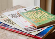 Thumbnail 8 of 23 - a stack of crossword puzzles on a table
