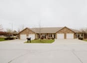 Thumbnail 16 of 23 - a house with two garage doors