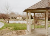 Thumbnail 12 of 23 - a gazebo with a pond in the background