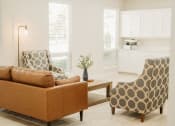 Thumbnail 5 of 23 - a living room with two chairs and a couch