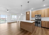 Thumbnail 51 of 53 - A kitchen with wooden cabinets and a stainless steel oven.
