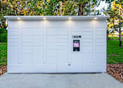Thumbnail 18 of 25 - A white garage door with a sign on it.