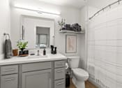 Thumbnail 12 of 12 - A bathroom with a white toilet, sink, and shower.
