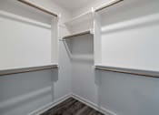 Thumbnail 10 of 15 - A white pantry with a wood shelf and a recycling symbol on the floor.
