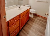 Thumbnail 21 of 23 - a bathroom with a toilet sink and mirror