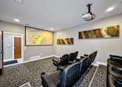 Thumbnail 6 of 42 - A Room With a Projector Screen at Capitol Grove Apartments, Iowa