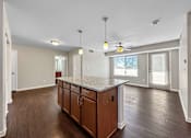Thumbnail 9 of 42 - A Kitchen With a Countertop at Capitol Grove Apartments, Des Moines