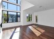 Thumbnail 16 of 86 - Empty living room with large windows at 44 Washington, Kansas City, Missouri