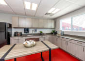 Thumbnail 5 of 34 - a kitchen with wooden cabinets and a table with a bowl of eggs