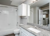 Thumbnail 31 of 37 - a bathroom with a sink and a toilet and a bath tub