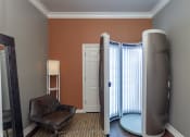 Thumbnail 10 of 37 - a room with a heater and a chair and a window