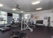 Thumbnail 9 of 37 - gym with exercise equipment and windows at the apartments