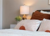 Thumbnail 26 of 36 - a bed with white sheets and pillows and a lamp at Hillcrest Village, Springdale