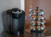 Thumbnail 14 of 50 - a coffee maker and coffee cups on a table