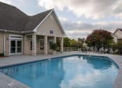 Thumbnail 3 of 50 - Pool with chairs and clubhouse in view