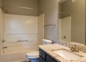 Thumbnail 44 of 50 - a bathroom with a toilet sink and bathtub