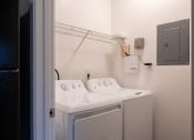 Thumbnail 22 of 50 - a washer and dryer in a laundry room
