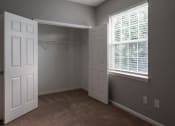 Thumbnail 27 of 50 - a bedroom with two windows and two closets