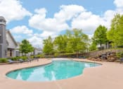 Thumbnail 14 of 37 - sparkling swimming pool with outdoor seating area