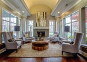 Thumbnail 4 of 37 - contemporary clubhouse seating area with large windows and vaulted ceilings