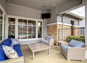 Thumbnail 15 of 37 - outdoor seating area with patio furniture and tv screen
