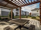 Thumbnail 18 of 37 - outdoor seating area under pergola with landscaping